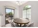 Dining area featuring sliding door access to the backyard patio and an arched window at 336 N 168Th Dr, Goodyear, AZ 85338