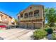 Exterior of a three-story home featuring a three-car garage at 336 N 168Th Dr, Goodyear, AZ 85338