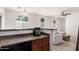 Open concept featuring kitchen, living room and dining area. Arched windows, and ceiling fan at 336 N 168Th Dr, Goodyear, AZ 85338