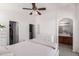 Primary bedroom featuring ensuite bathroom, vaulted ceilings and ceiling fan at 336 N 168Th Dr, Goodyear, AZ 85338