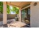 Covered patio featuring brick pavers and an air conditioning unit at 336 N 168Th Dr, Goodyear, AZ 85338