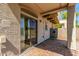 Spacious covered patio with brick pavers, accessible through sliding glass doors at 336 N 168Th Dr, Goodyear, AZ 85338