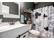 Stylish bathroom with modern sink, stylish mirror and fun shower curtain at 3480 E Cullumber Ct, Gilbert, AZ 85234