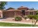 Charming single-story home with a two-car garage and desert landscaping, creating an inviting curb appeal at 3480 E Cullumber Ct, Gilbert, AZ 85234