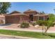 A well-maintained single story home featuring desert landscaping, a two-car garage, and a welcoming front entrance at 3480 E Cullumber Ct, Gilbert, AZ 85234
