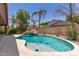Stunning backyard pool featuring a rock waterfall, slide, lush landscaping, and ample space for outdoor enjoyment at 3480 E Cullumber Ct, Gilbert, AZ 85234