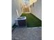Narrow backyard with turf, pavers, gravel, block wall, AC unit, and gate to alley at 3480 E Sheffield Rd, Gilbert, AZ 85296