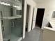 Bathroom featuring a shower, toilet, and dual sink vanity at 3480 E Sheffield Rd, Gilbert, AZ 85296