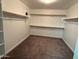 Walk-in closet features shelving, carpeting, and a window at 3480 E Sheffield Rd, Gilbert, AZ 85296