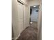 Hallway leading to a laundry room with plenty of storage space at 3480 E Sheffield Rd, Gilbert, AZ 85296