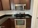 Close-up of a well-equipped kitchen with stainless steel appliances and granite countertops at 3480 E Sheffield Rd, Gilbert, AZ 85296
