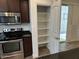 Gourmet kitchen features stainless steel appliances, a pantry, and granite countertops at 3480 E Sheffield Rd, Gilbert, AZ 85296