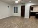 Bright and airy living room with tile floors, ceiling fan, and arched entrance to the kitchen at 3480 E Sheffield Rd, Gilbert, AZ 85296
