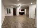 The living room has tile floors that lead to the kitchen and a closed door at 3480 E Sheffield Rd, Gilbert, AZ 85296