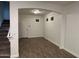 An empty living room with tiled floors with a staircase at 3480 E Sheffield Rd, Gilbert, AZ 85296