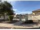 Community Pool gated for safety, surrounded by mature landscaping, and a restroom area at 3480 E Sheffield Rd, Gilbert, AZ 85296
