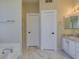 Bathroom with double sink vanity, marble floors, and shower at 3634 N Desert Oasis --, Mesa, AZ 85207