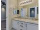 Bathroom featuring a double vanity, granite countertop, and a view to the bedroom at 3634 N Desert Oasis --, Mesa, AZ 85207