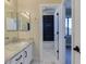 Bathroom with double sink vanity, granite countertop, and a shower at 3634 N Desert Oasis --, Mesa, AZ 85207