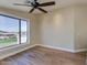 Bright bedroom with hardwood floors, ceiling fan, and a mountain view at 3634 N Desert Oasis --, Mesa, AZ 85207