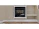 Close up of the fireplace with built-in shelving, and hardwood floors at 3634 N Desert Oasis --, Mesa, AZ 85207