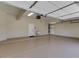 Spacious garage featuring epoxy flooring, utility sink, and ample storage space at 3634 N Desert Oasis --, Mesa, AZ 85207