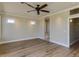 Bright living room with hardwood flooring, recessed lights, and a modern ceiling fan at 3634 N Desert Oasis --, Mesa, AZ 85207