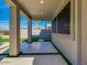 Covered patio features artificial grass, pavers, and seamless transition to the outdoor space at 3634 N Desert Oasis --, Mesa, AZ 85207