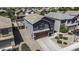 Aerial view of a two-story home featuring a gray stucco exterior and a two-car garage at 36562 W Nina St, Maricopa, AZ 85138