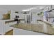 Kitchen featuring granite counters, modern appliances, white cabinets and pendant lights at 36562 W Nina St, Maricopa, AZ 85138
