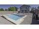 A refreshing backyard pool with lounge chairs invites relaxation at this beautiful property at 36562 W Nina St, Maricopa, AZ 85138