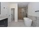 Contemporary bathroom with a standalone soaking tub, glass-enclosed shower, and stylish fixtures at 3831 N 8Th St, Phoenix, AZ 85014