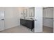 Bathroom featuring a modern double vanity and access to a walk-in closet at 3831 N 8Th St, Phoenix, AZ 85014