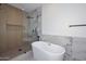 Bathroom highlighting a modern soaking tub adjacent to a glass enclosed shower at 3831 N 8Th St, Phoenix, AZ 85014