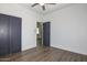 Cozy bedroom with hardwood floors, closet with modern doors, and neutral walls providing a relaxing atmosphere at 3831 N 8Th St, Phoenix, AZ 85014