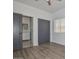 Bright bedroom with contemporary closet doors, wood-look flooring, and an en-suite bathroom for added convenience at 3831 N 8Th St, Phoenix, AZ 85014