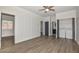 Spacious bedroom featuring hardwood floors and an ensuite laundry area for convenience at 3831 N 8Th St, Phoenix, AZ 85014