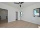 Bright bedroom with laminate floors, windows, and a closet at 3831 N 8Th St, Phoenix, AZ 85014