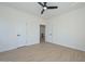 Cozy bedroom with laminate floors, a modern ceiling fan, and an open closet at 3831 N 8Th St, Phoenix, AZ 85014