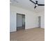 Bright bedroom with wood-look floors, ceiling fan, recessed lighting, and white doors leading to the closet and bathroom at 3831 N 8Th St, Phoenix, AZ 85014