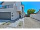 Attractive two-story home with a balcony, dark front door, and landscaped front yard at 3831 N 8Th St, Phoenix, AZ 85014