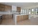 Modern kitchen with stainless steel appliances, hardwood floors, island, and quartz countertops at 3831 N 8Th St, Phoenix, AZ 85014