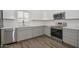 Modern kitchen with stainless steel appliances, wood floors, and white countertops, offering both style and functionality at 3831 N 8Th St, Phoenix, AZ 85014