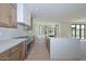 Spacious kitchen featuring an island, wooden cabinets, stainless steel appliances, and ample counter space at 3831 N 8Th St, Phoenix, AZ 85014