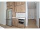 A kitchen with stainless steel appliances and wooden cabinets at 3831 N 8Th St, Phoenix, AZ 85014