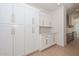 Bright kitchen with white cabinets, gold hardware, and ample counter space at 3831 N 8Th St, Phoenix, AZ 85014