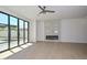 Hardwood floors in living room with patio access and modern fireplace at 3831 N 8Th St, Phoenix, AZ 85014