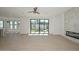 Spacious living room with hardwood floors, view to backyard, and modern fireplace at 3831 N 8Th St, Phoenix, AZ 85014