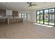 Open-concept living space with hardwood floors, fan, and view to the back yard at 3831 N 8Th St, Phoenix, AZ 85014