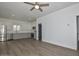 Open-concept living space with hardwood floors, ceiling fan, and stainless steel appliances at 3831 N 8Th St, Phoenix, AZ 85014